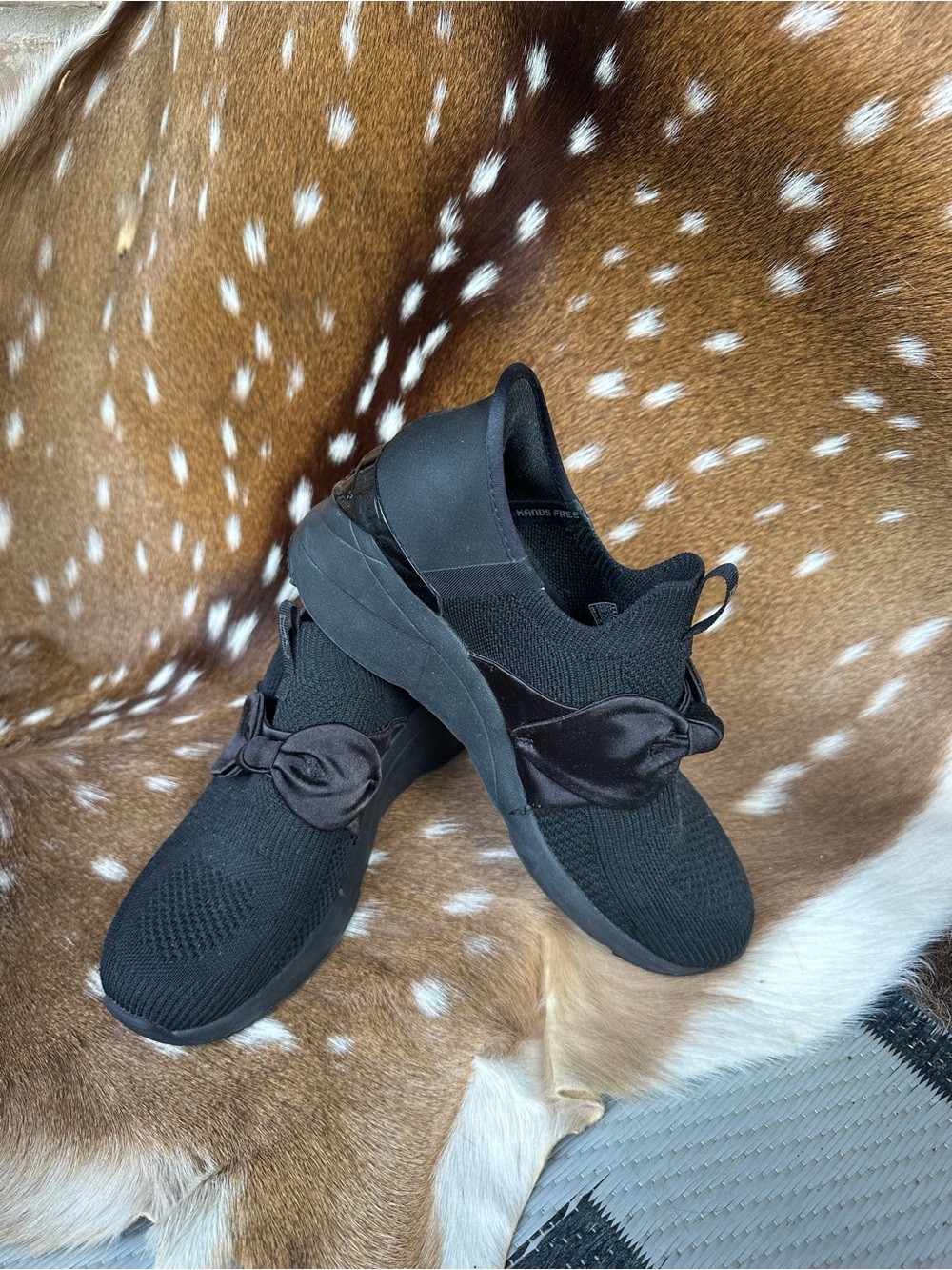 Skechers Women’s Black Slip-On Knit Sneakers with Satin Bow Accent